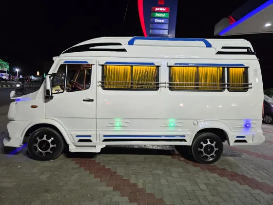 Tempo Traveller illuminated at night