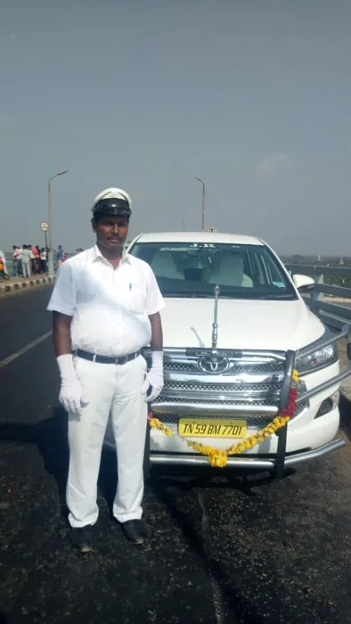 Traveller beside a rental car
