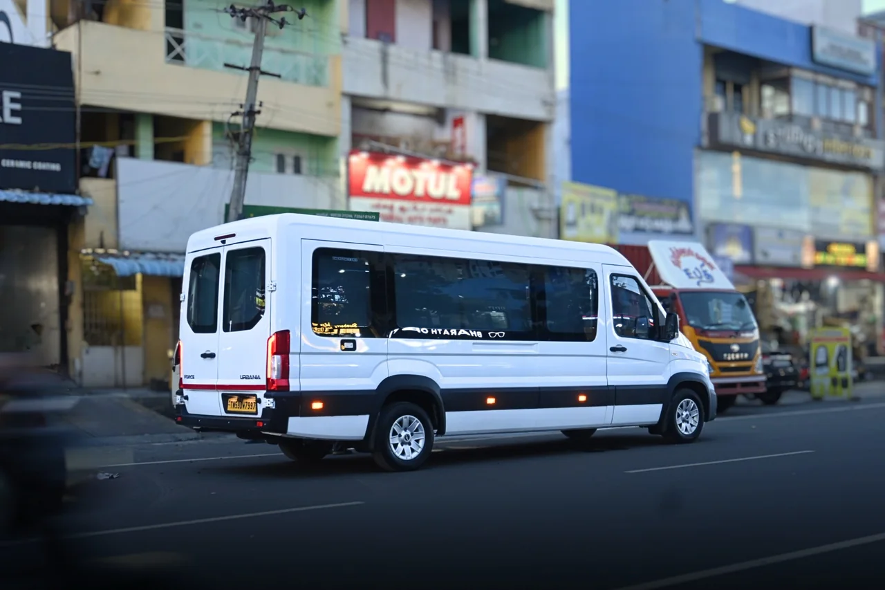 Side and rear view of the white Urbania van