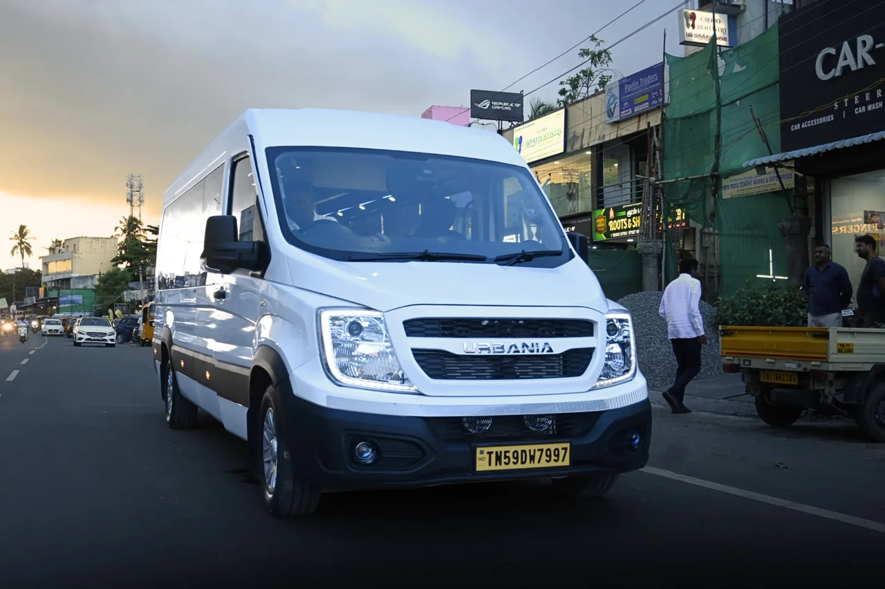 Front view of the white Urbania van on a Madurai street