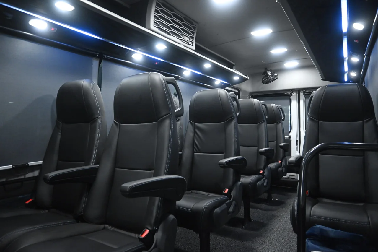 Comfortable pushback seats inside the Urbania van